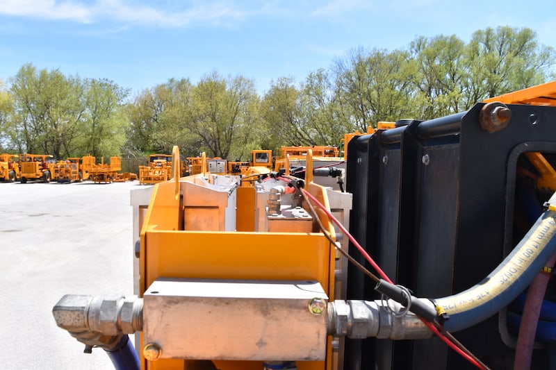 A close up picture of Maclean's Mine-Mate Series BT2 & BT3-Boom Truck that are leveraged MEDATech's hydraulic system design services and our proprietary 25kW on-board charging solution.