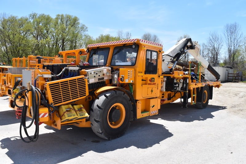 A wide picture of Maclean's Mine-Mate Series BT2 & BT3-Boom Truck that are leveraged MEDATech's hydraulic system design services.