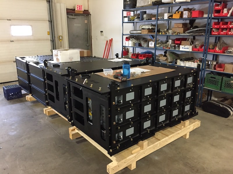 A picture of multiple lithium ion battery packs ready for delivery